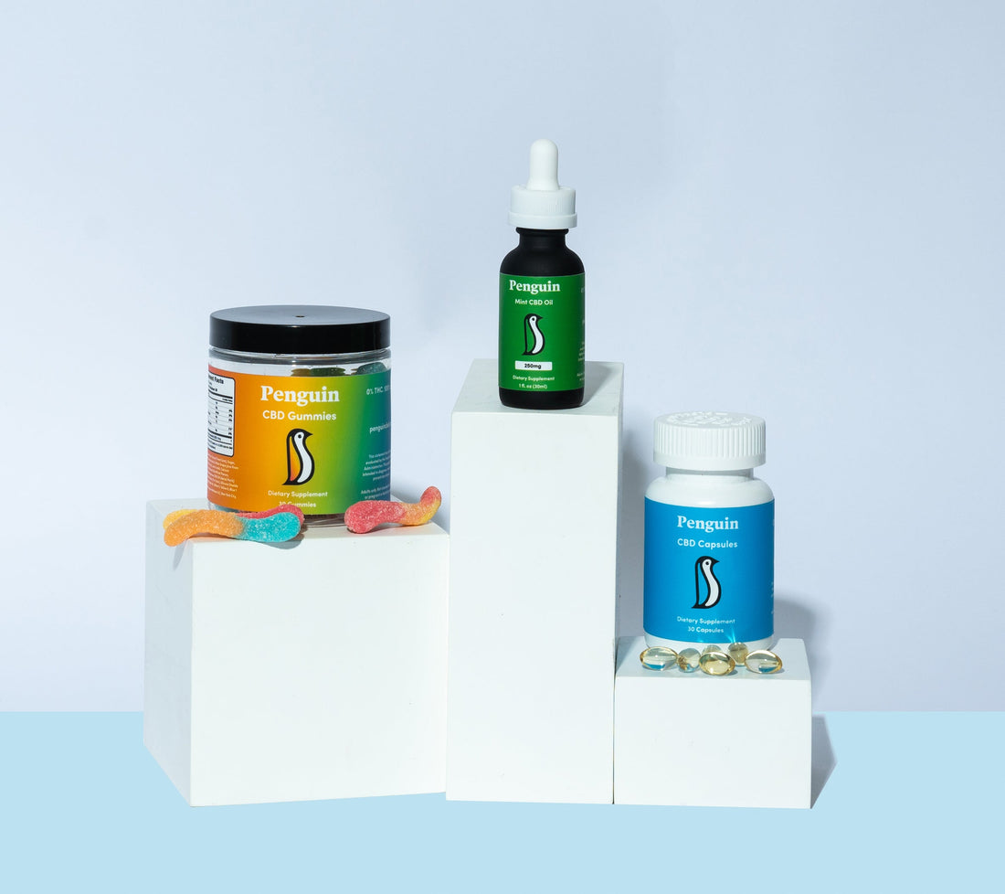 CBD oil bottle and CBD softgel capsules side by side showing the difference between sublingual oil and capsule delivery methods for daily hemp wellness