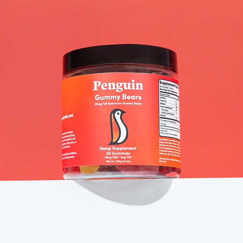 Jar of Penguin Gummy Bears hemp supplement on a red background