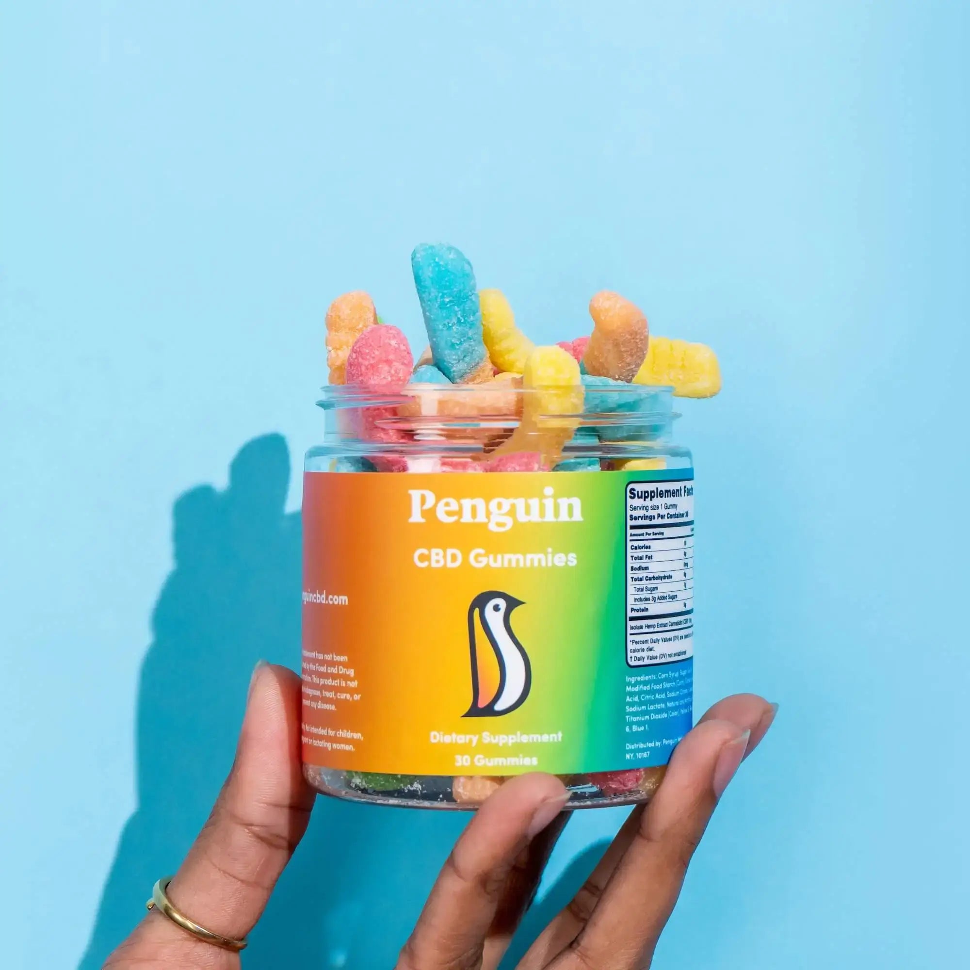 Penguin CBD Jar of colorful CBD gummies 